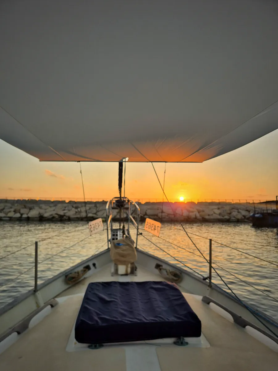 Sunset seen from the foredeck beneath a SunSkipper canopy
